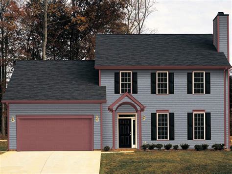 gray house dark gray metal roof|dark grey brick house.